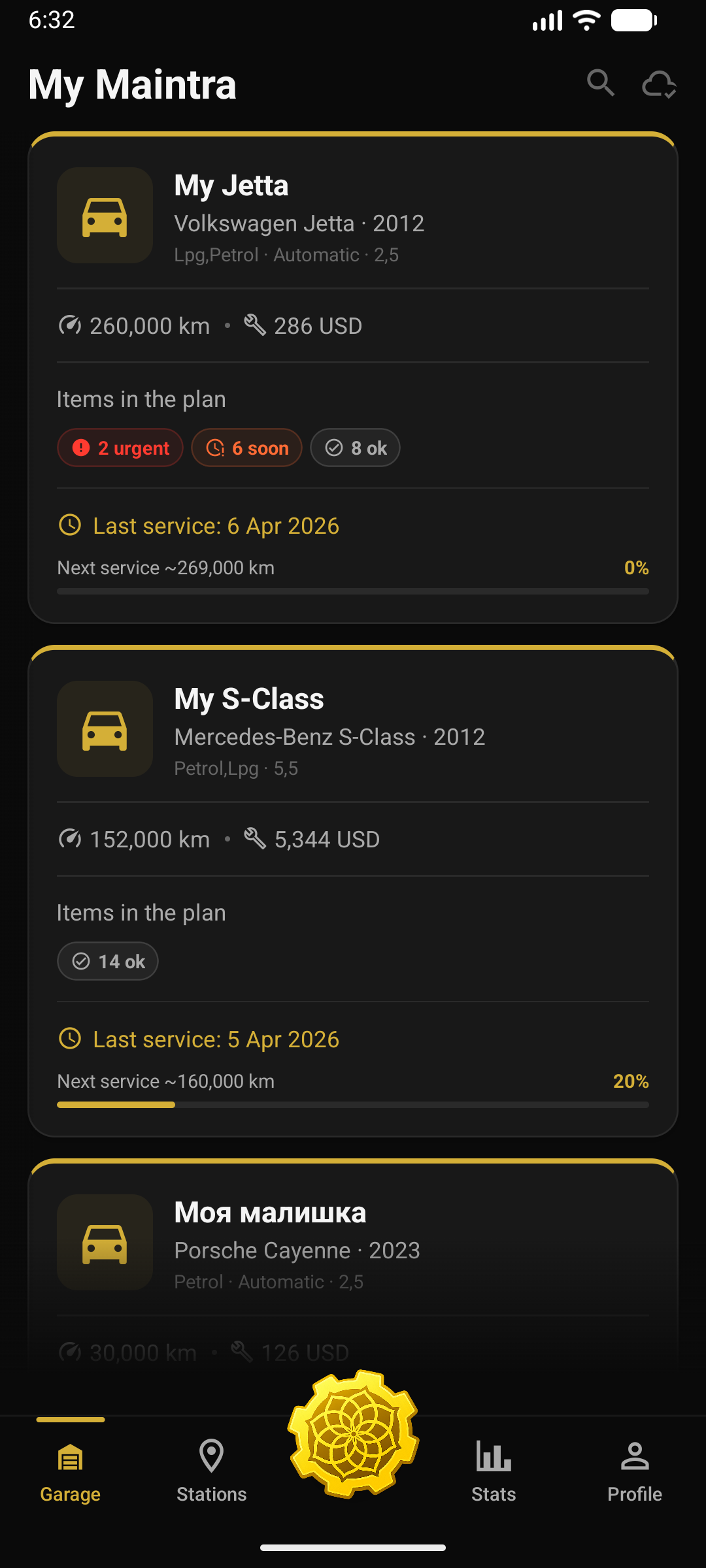 Maintra app garage screen showing three tracked vehicles, mileage, and service status